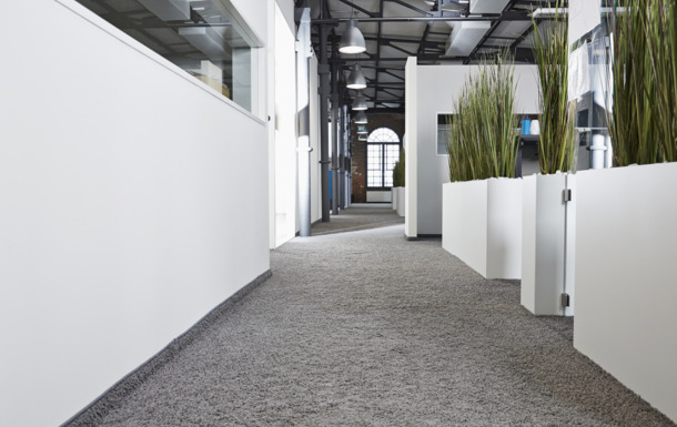 Office carpet showcasing Clariant's Nylostab S-EED stabilizer for consistent dyeability and color stability in PA nylon fibers.