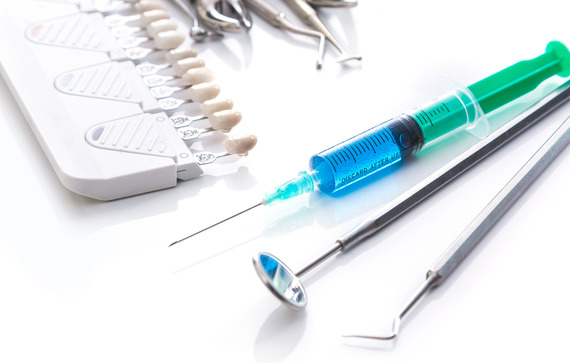Image Different dental tools and syringe with anesthesia