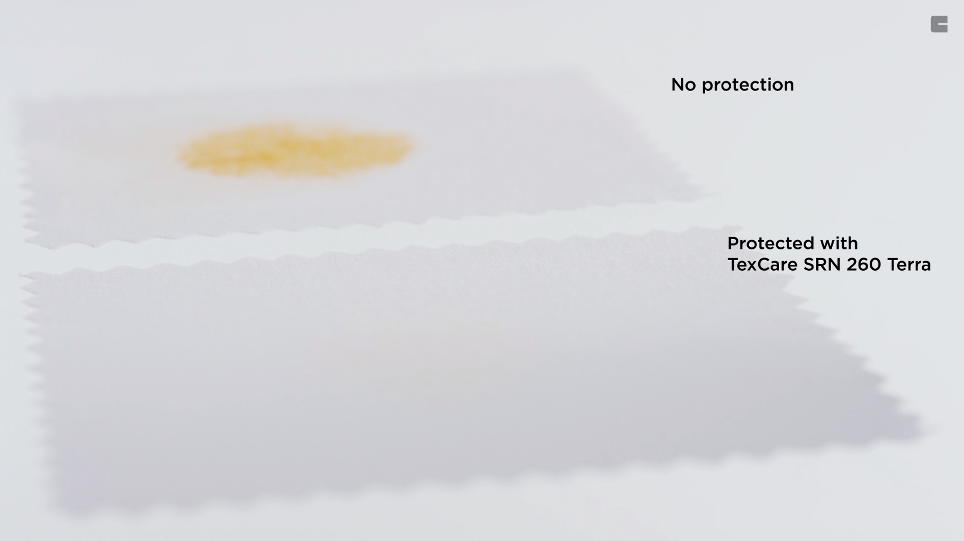 The image shows two fabric samples side by side with a liquid stain on each. The top fabric sample is labeled "No protection" and has a visible yellowish stain, indicating that the liquid has soaked into the fabric. The bottom fabric sample is labeled "Protected with TexCare SRN 260 Terra" and shows no visible stain, indicating that the fabric has been treated with a protective coating that prevents the liquid from soaking in. This demonstrates the effectiveness of TexCare SRN 260 Terra in protecting fabric from stains.