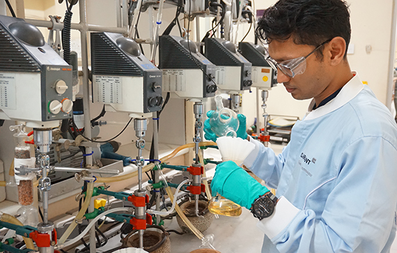 Chemist in lab coat working