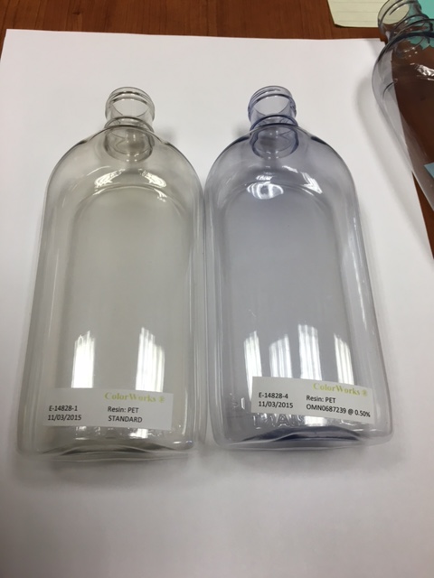 The uncolored PET bottle on the left was made using 25% PCR while the one on the right has the same ...