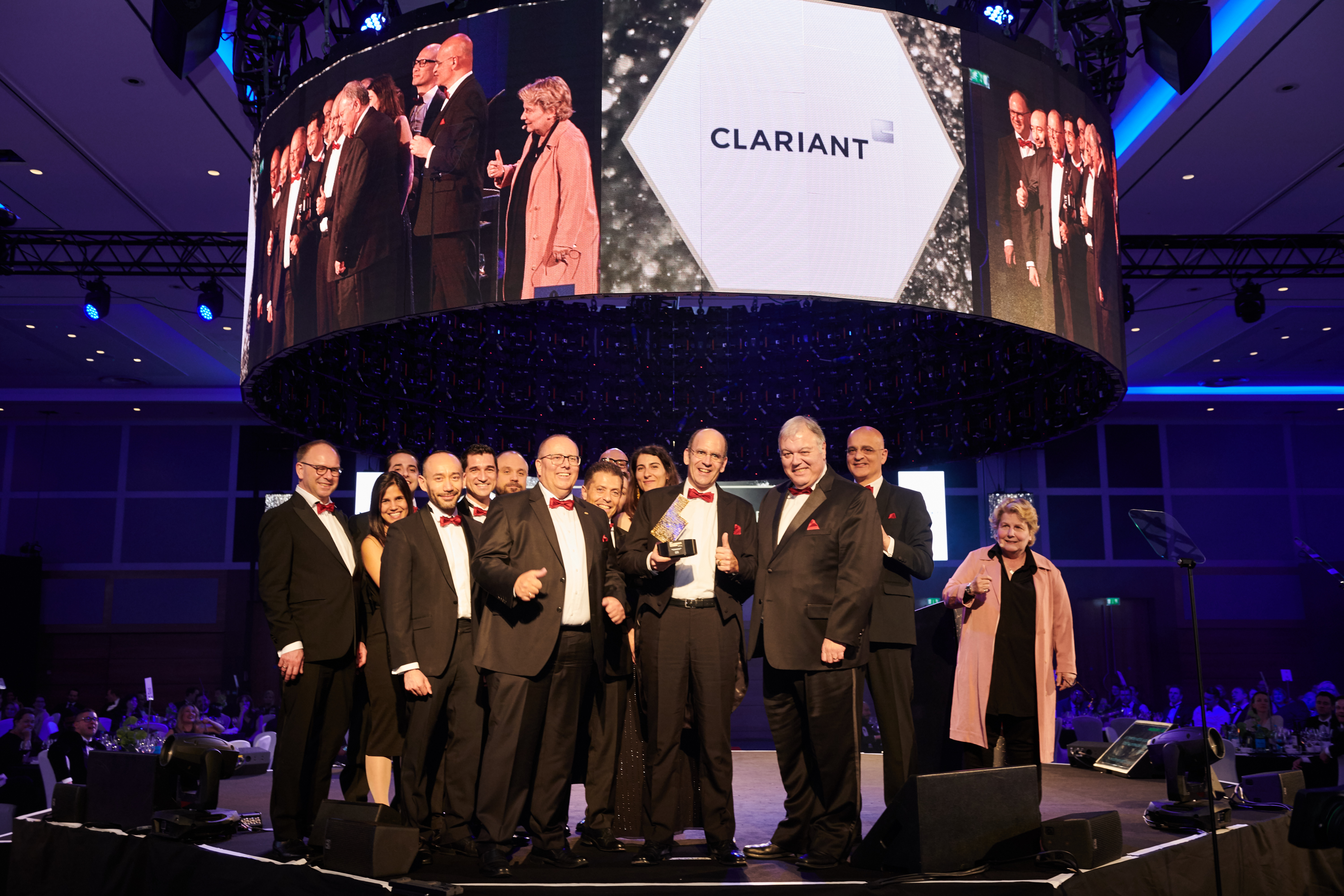 A delegation of Clariant employees, accompanied by Board of Directors member Carlo G. Soave, accep...