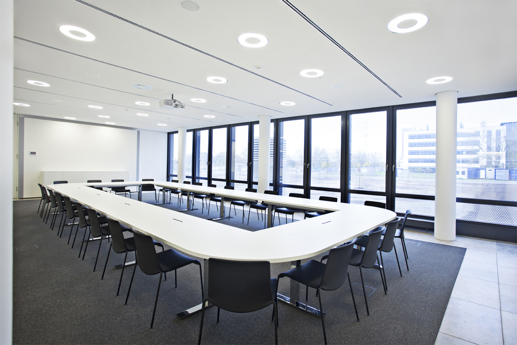  The conference hall holds enough seats for a large number of attendants.